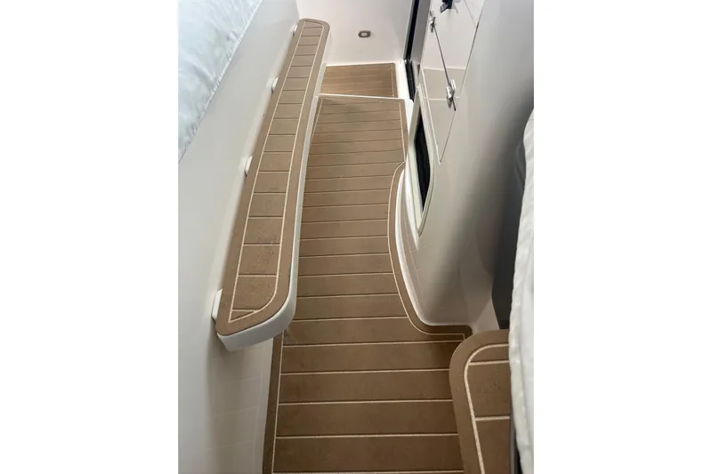 Summah Sled Yacht Photos Pics 1999 Tiara Yachts 4000 Express interior with sleek, modern flooring and cabinetry.