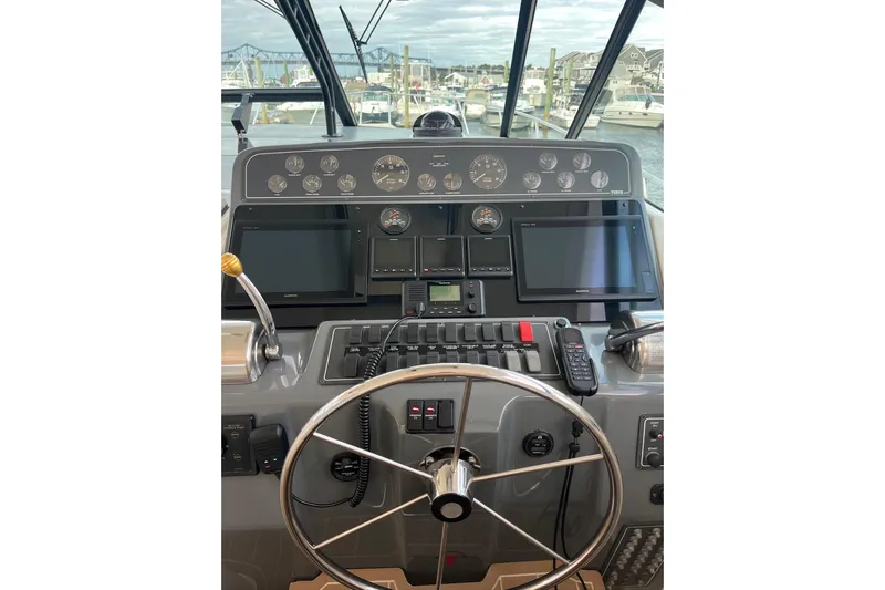 Summah Sled Yacht Photos Pics 1999 Tiara Yachts 4000 Express helm with modern navigation equipment and controls.