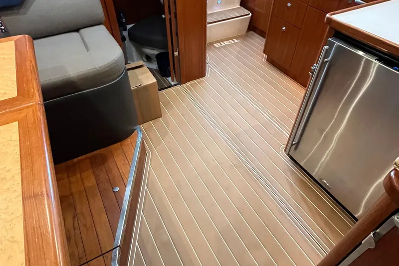 Summah Sled Yacht Photos Pics Interior of 1999 Tiara Yachts 4000 Express with wood flooring and modern amenities.