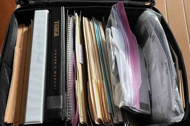 Summah Sled Yacht Photos Pics Collection of manuals and documents for 1999 Tiara Yachts 4000 Express in a case.