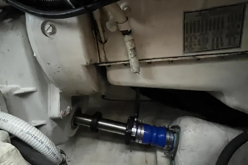 Summah Sled Yacht Photos Pics Engine compartment of a 1999 Tiara Yachts 4000 Express, showcasing mechanical components.