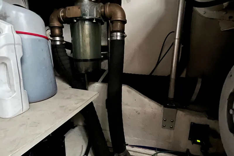 Summah Sled Yacht Photos Pics Engine room of 1999 Tiara Yachts 4000 Express with hoses and equipment.