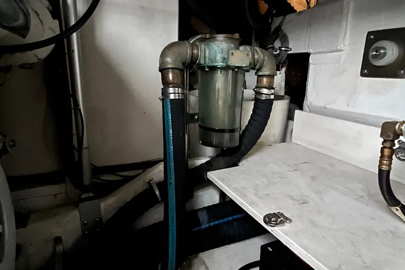 Summah Sled Yacht Photos Pics Engine room of 1999 Tiara Yachts 4000 Express showing plumbing and mechanical components.