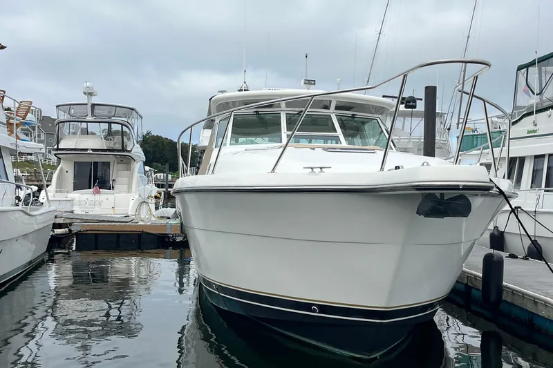 Summah Sled Yacht Photos Pics 1999 Tiara Yachts 4000 Express docked at marina, front view.