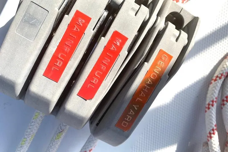 Sweet & Salty Yacht Photos Pics Close-up of Hunter 39 sailboat rope clutches labeled "Main Furl" and "Genoa Halyard," 2011 model.