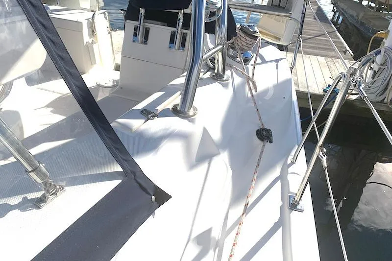 Sweet & Salty Yacht Photos Pics 2011 Hunter 39 sailboat deck with ropes and railing at a marina.