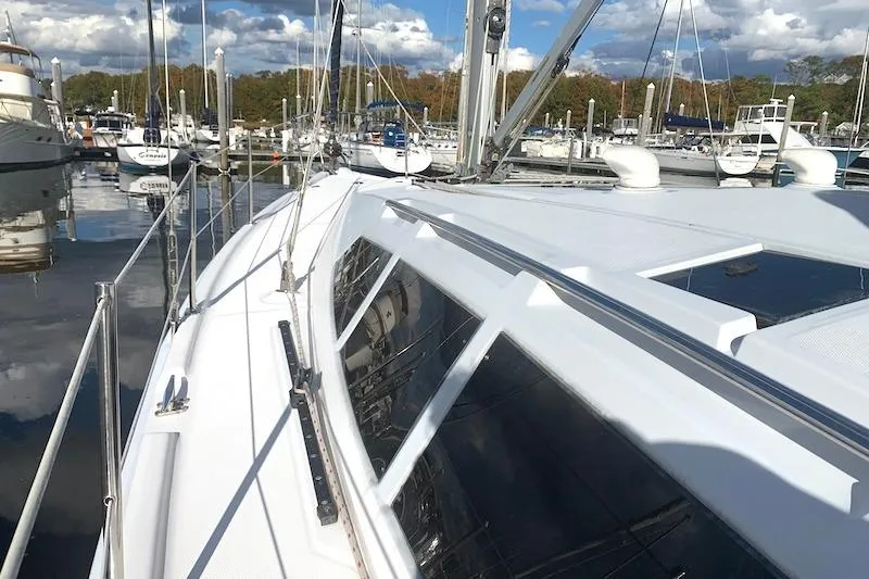 Sweet & Salty Yacht Photos Pics 2011 Hunter 39 sailboat docked at a marina under a partly cloudy sky.