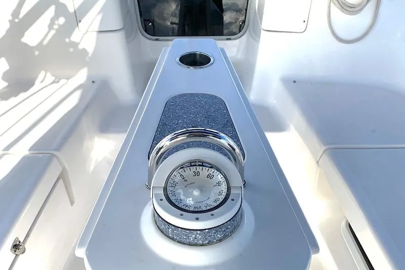Sweet & Salty Yacht Photos Pics Hunter 39 sailboat cockpit with compass, 2011 model, featuring sleek white design.