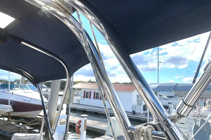 Sweet & Salty Yacht Photos Pics 2011 Hunter 39 sailboat with stainless steel frame and marina backdrop.