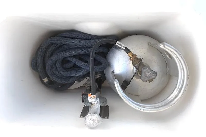 Sweet & Salty Yacht Photos Pics Coiled rope and metal tank in Hunter 39 sailboat storage compartment, 2011 model.