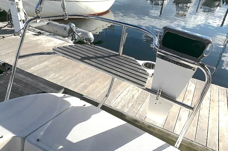 Sweet & Salty Yacht Photos Pics Cockpit of 2011 Hunter 39 sailboat with steering wheel and dock view.