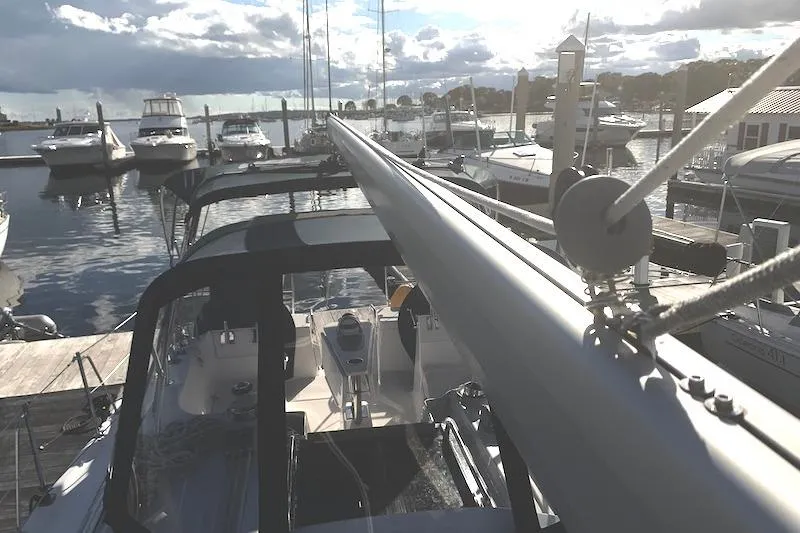 Sweet & Salty Yacht Photos Pics Sailboat docked at marina, Hunter 39 model, 2011, with clear sky and water reflections.