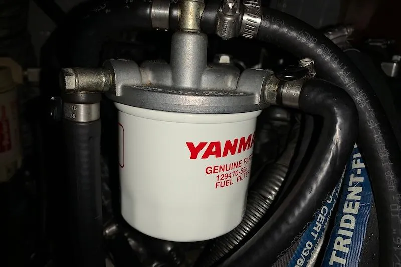 Sweet & Salty Yacht Photos Pics Yanmar fuel filter in a 2011 Hunter 39 engine compartment.
