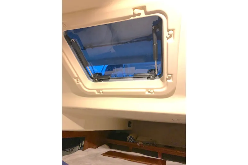 Sweet & Salty Yacht Photos Pics Cabin interior of 2011 Hunter 39 sailboat with open hatch window.