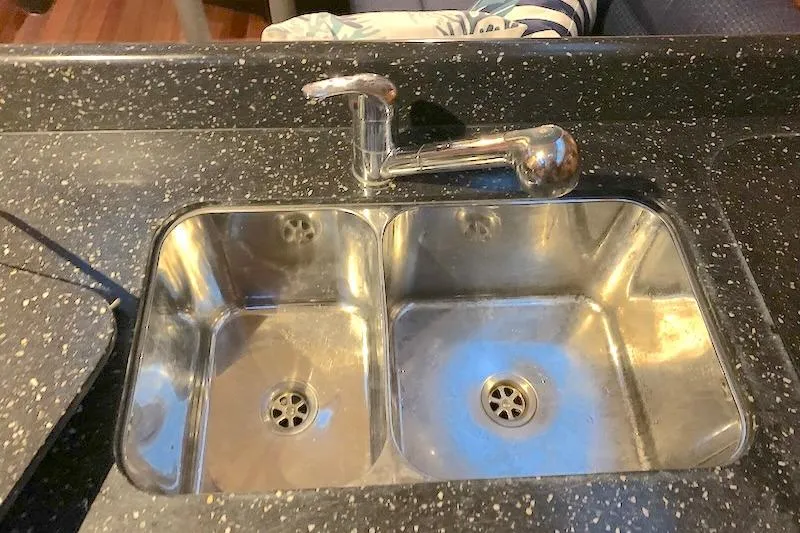 Sweet & Salty Yacht Photos Pics Stainless steel double sink with chrome faucet in 2011 Hunter 39 kitchen.