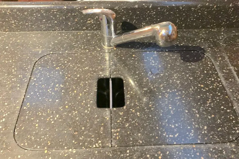 Sweet & Salty Yacht Photos Pics Granite countertop with integrated sink and chrome faucet, Hunter 39, 2011 model.