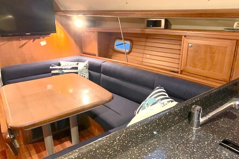 Sweet & Salty Yacht Photos Pics Interior of 2011 Hunter 39 sailboat with cozy dining area and modern amenities.