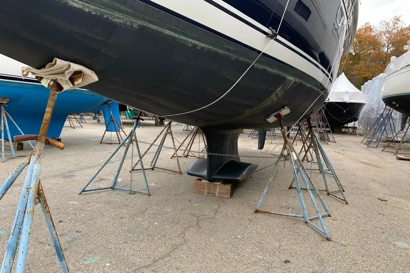 Sweet & Salty Yacht Photos Pics 2011 Hunter 39 sailboat on stands in a boatyard, keel visible.