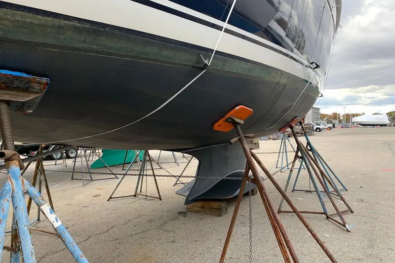 Sweet & Salty Yacht Photos Pics 2011 Hunter 39 sailboat on stands in a boatyard, showing hull and keel.