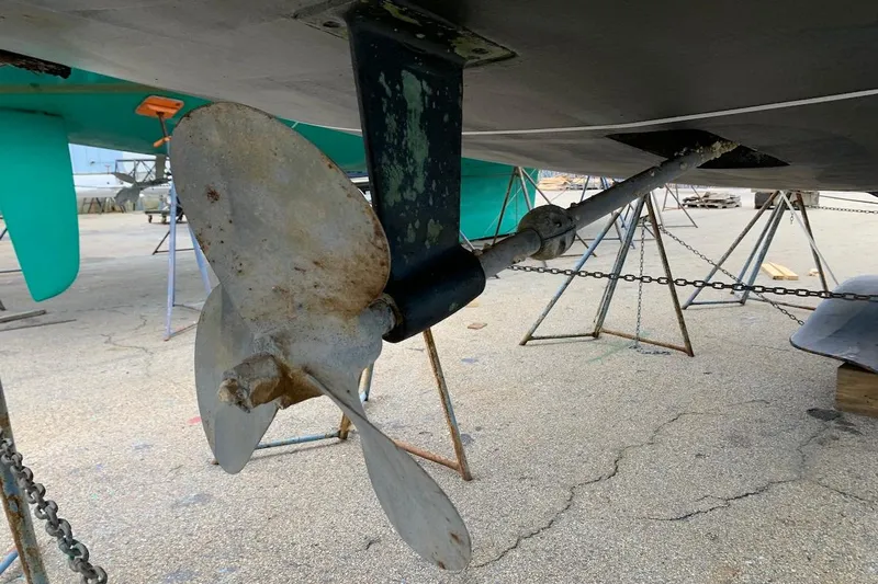 Sweet & Salty Yacht Photos Pics Propeller of 2011 Hunter 39 sailboat on dry dock, showing wear and maintenance needs.