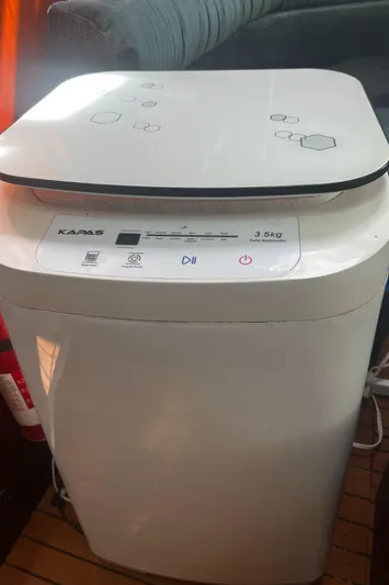 Chivalry Yacht Photos Pics Compact washing machine on Beneteau 461 yacht, 2000 model, with digital controls.