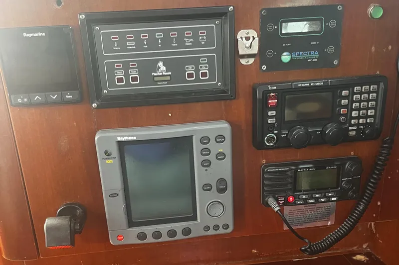 Chivalry Yacht Photos Pics Control panel of a 2000 Beneteau 461 yacht with navigation and communication equipment.
