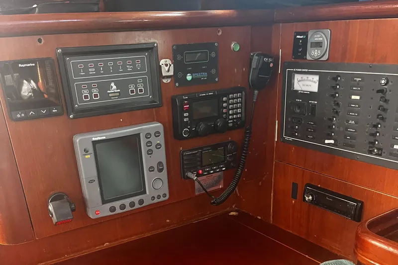 Chivalry Yacht Photos Pics Control panel of a 2000 Beneteau 461 sailboat with navigation and communication equipment.