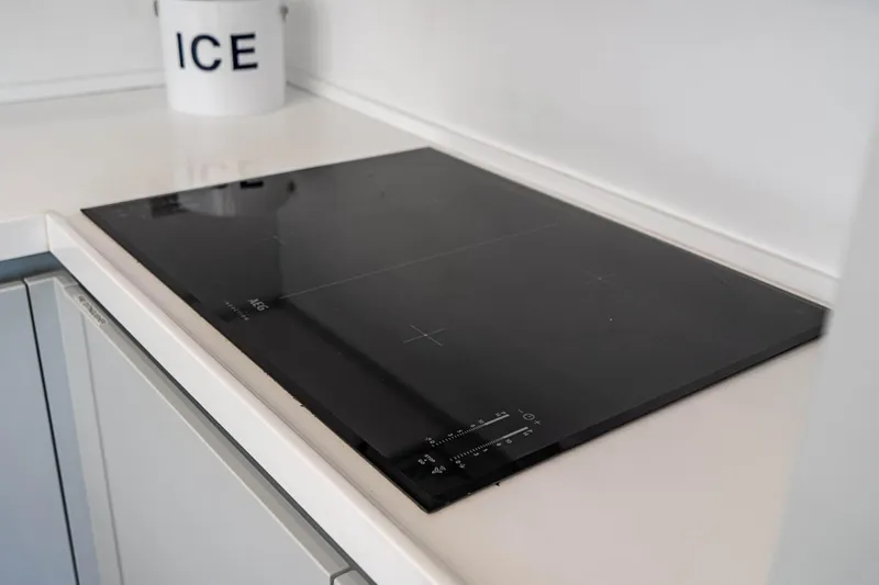 Persistence Yacht Photos Pics Cooktop on Overblue 58 Power Catamaran, year 2017.