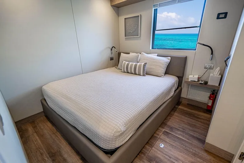 Persistence Yacht Photos Pics Interior of 2017 Overblue 58 Power Catamaran with cozy bedroom and ocean view.