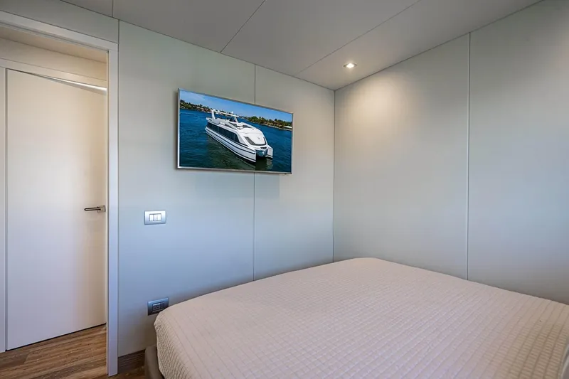 Persistence Yacht Photos Pics Interior of Overblue 58 Power Catamaran yacht, bedroom with wall art.