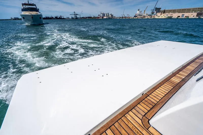 Persistence Yacht Photos Pics Overblue 58 Power Catamaran 2017 at sea with harbor in background.