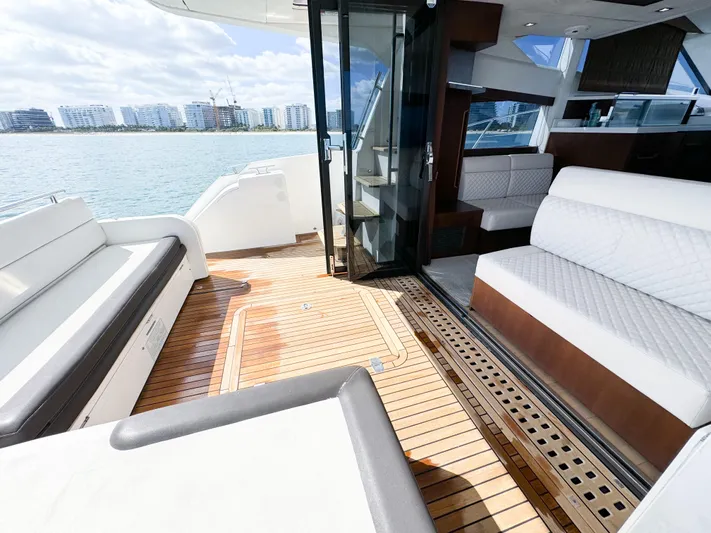  Yacht Photos Pics 2016 Galeon 420 Fly yacht interior with elegant seating and wooden flooring.