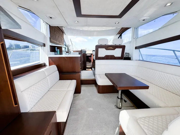  Yacht Photos Pics Luxurious interior of 2016 Galeon 420 Fly yacht with elegant seating and panoramic windows.