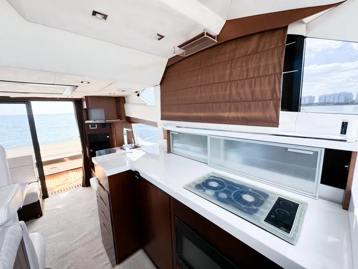  Yacht Photos Pics Luxurious interior of 2016 Galeon 420 Fly yacht with modern kitchen and sea view.