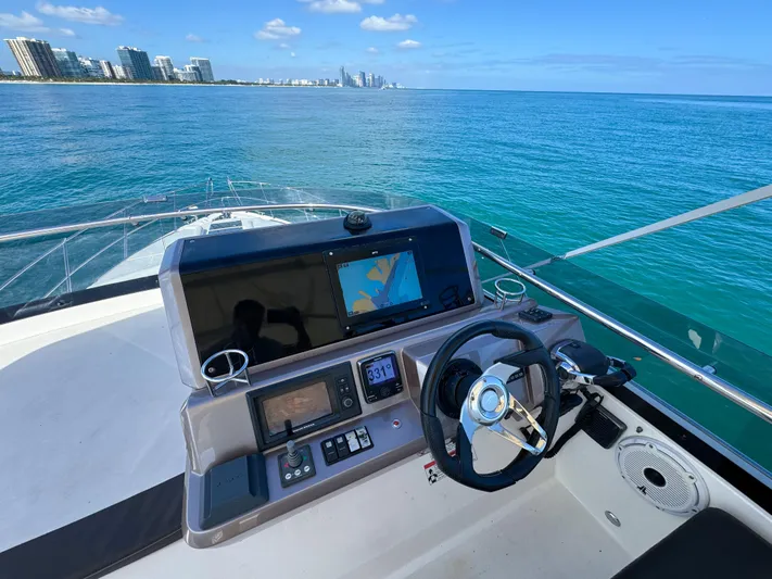  Yacht Photos Pics Galeon 420 Fly 2016 yacht helm with ocean view and city skyline.