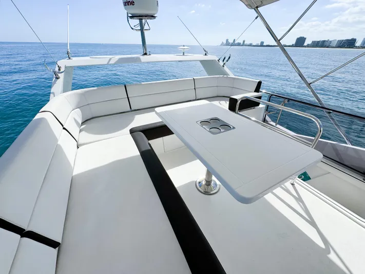  Yacht Photos Pics Galeon 420 Fly 2016 yacht flybridge with seating and table, ocean view.