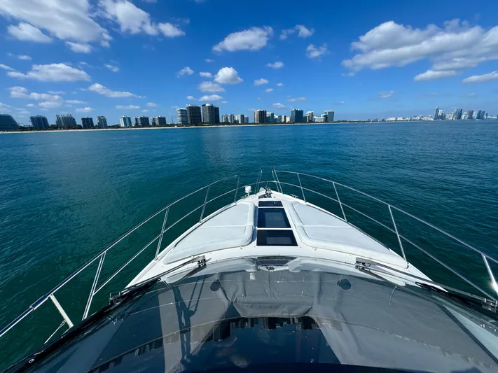  Yacht Photos Pics Galeon 420 Fly 2016 yacht cruising on blue ocean with city skyline.
