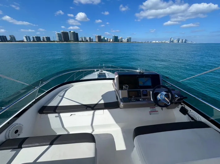  Yacht Photos Pics Galeon 420 Fly 2016 yacht helm with ocean view and city skyline.