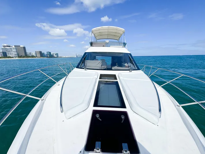 Yacht Photos Pics Galeon 420 Fly 2016 yacht cruising on clear blue ocean near city skyline.