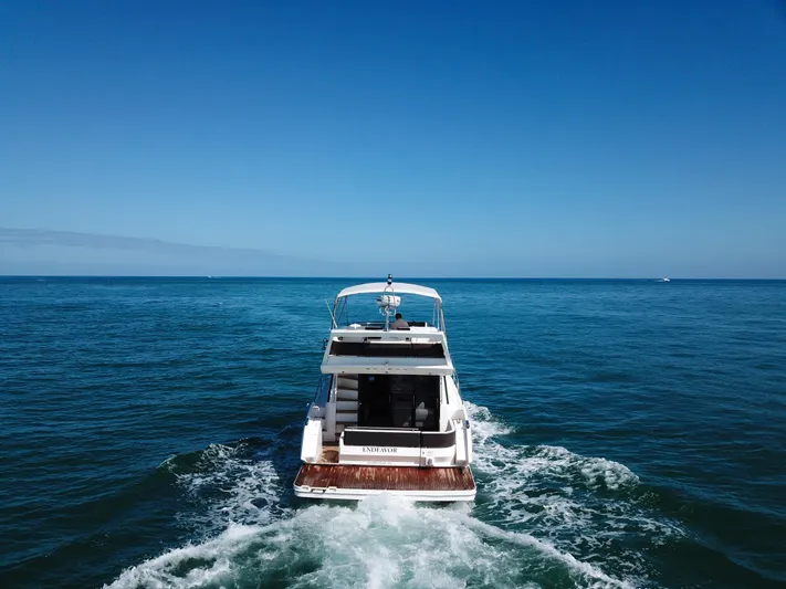  Yacht Photos Pics Galeon 420 Fly 2016 yacht cruising on open sea under clear blue sky.
