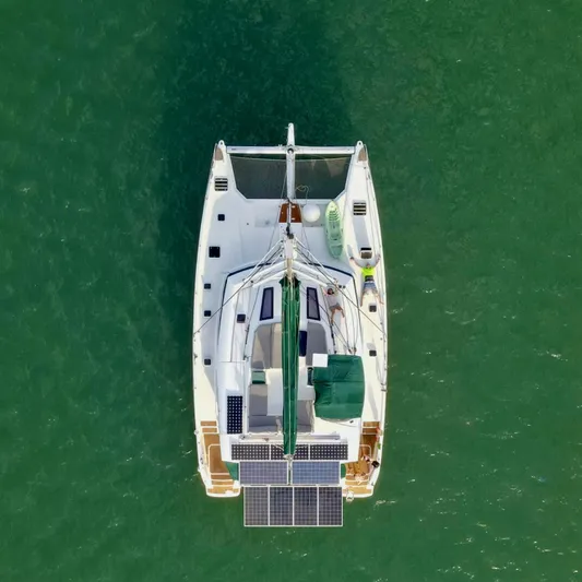Jajapami Yacht Photos Pics Aerial view of 2017 Fountaine Pajot SABA 50 catamaran on green water.