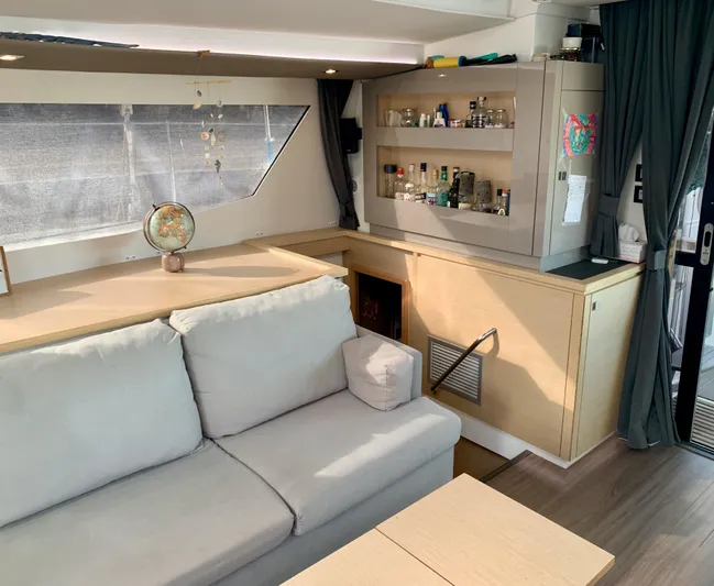 Jajapami Yacht Photos Pics Interior of 2017 Fountaine Pajot SABA 50 yacht with cozy seating and bar area.