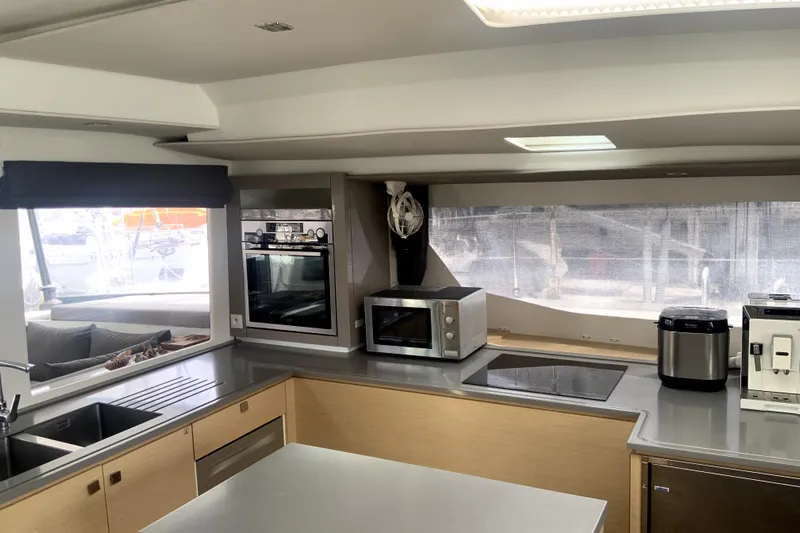 Jajapami Yacht Photos Pics Modern kitchen interior of 2017 Fountaine Pajot SABA 50 catamaran with appliances and sleek design.