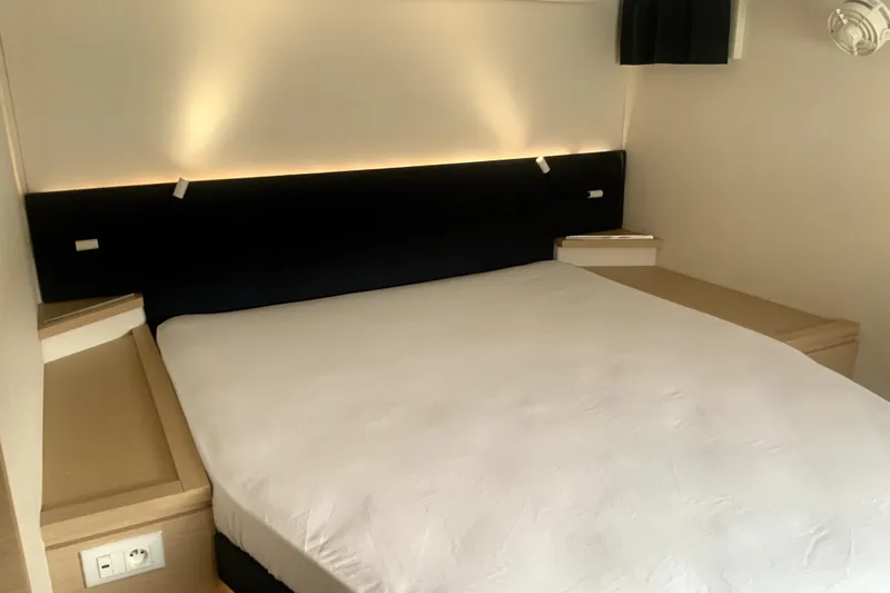Jajapami Yacht Photos Pics Luxurious bedroom interior of 2017 Fountaine Pajot SABA 50 yacht with modern lighting.