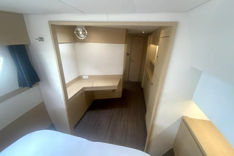 Jajapami Yacht Photos Pics Interior of 2017 Fountaine Pajot SABA 50 yacht, featuring modern wood finishes and ample storage.