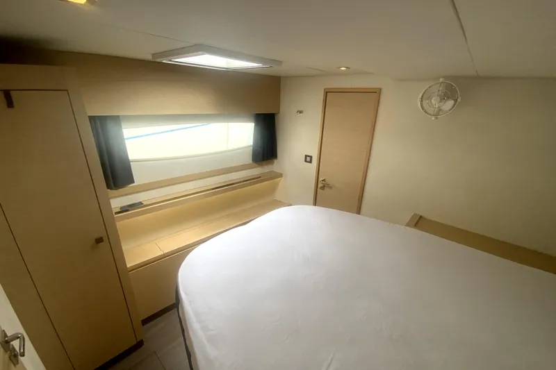 Jajapami Yacht Photos Pics Cabin interior of 2017 Fountaine Pajot SABA 50 catamaran, featuring a bed and window.