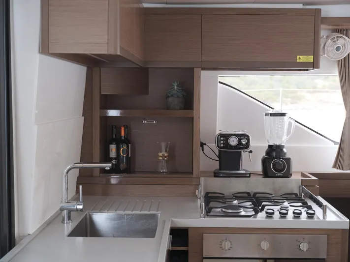  Yacht Photos Pics Modern kitchen in 2019 Lagoon 50 yacht with stove, sink, and appliances.