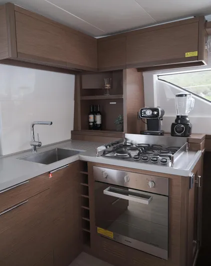  Yacht Photos Pics Modern kitchen in 2019 Lagoon 50 yacht with stove, oven, and appliances.