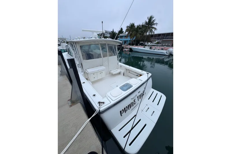  Yacht Photos Pics 2006 Tiara Yachts 3600 Open docked, featuring spacious deck and sleek design.