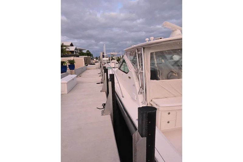  Yacht Photos Pics 2006 Tiara Yachts 3600 Open docked, showcasing sleek design and spacious deck.